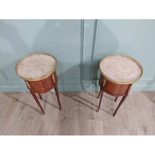 395 - Pair of French kingwood beside cabinets with marble tops and brass gallery with ormolu mounts in the... 