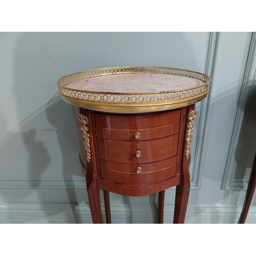 395 - Pair of French kingwood beside cabinets with marble tops and brass gallery with ormolu mounts in the... 