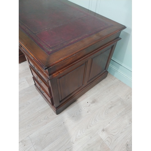 400A - Mahogany pedestal desk with inset leather top in the Victorian style. {77 cm H x 152 cm W x 90 cm}.