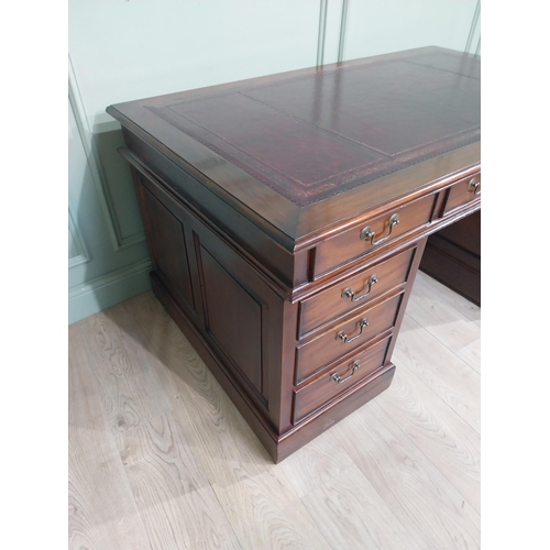 400A - Mahogany pedestal desk with inset leather top in the Victorian style. {77 cm H x 152 cm W x 90 cm}.