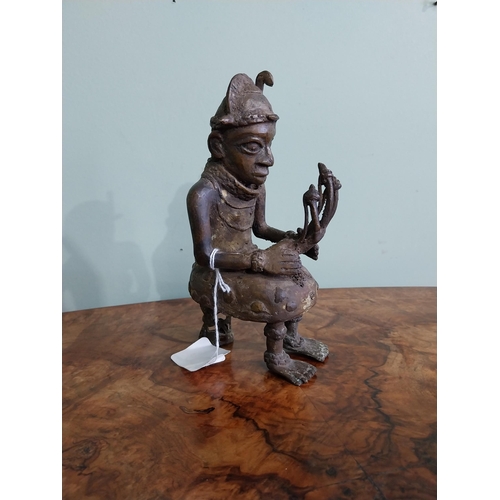 415 - African Benin bronze sculpture. {20 cm H x 9 cm W x 10 cm D}.