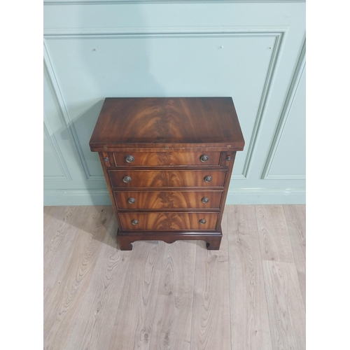 418 - Mahogany chest of drawers with two short drawers over three long drawers raised on shaped bracket fe... 