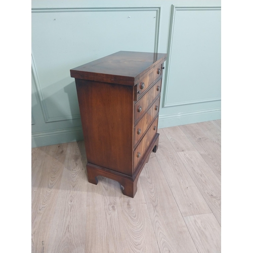 418 - Mahogany chest of drawers with two short drawers over three long drawers raised on shaped bracket fe... 