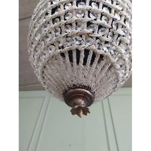 425 - French brass and cut crystal tear drop chandelier. {66 cm H x 33 cm Dia.}.