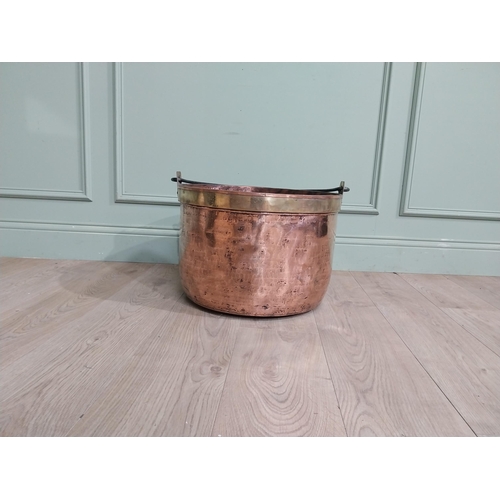 427 - 19th C. Copper and brass log bucket with wrought iron handle. {55 cm H x 52 cm Dia.}.