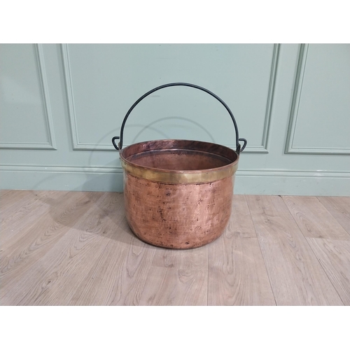 427 - 19th C. Copper and brass log bucket with wrought iron handle. {55 cm H x 52 cm Dia.}.