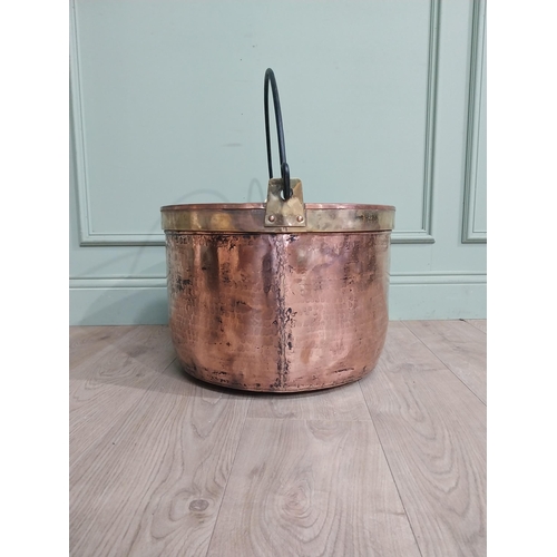 427 - 19th C. Copper and brass log bucket with wrought iron handle. {55 cm H x 52 cm Dia.}.