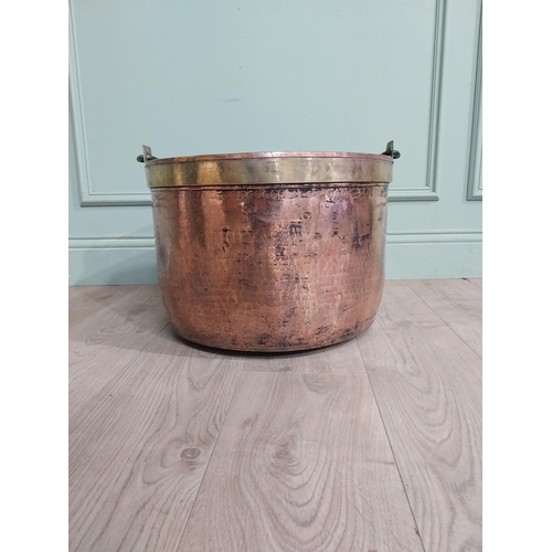 427 - 19th C. Copper and brass log bucket with wrought iron handle. {55 cm H x 52 cm Dia.}.