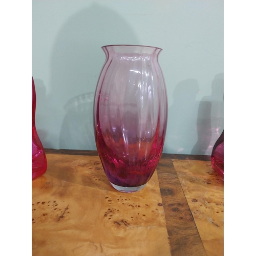 439 - Two shaped ruby glass bottles and vase. {20 cm H} and {18 cm H}