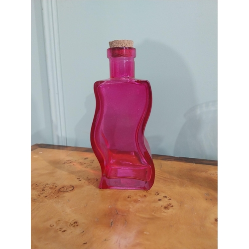 439 - Two shaped ruby glass bottles and vase. {20 cm H} and {18 cm H}