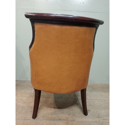 451 - Mahogany tan leather deep buttoned armchair with swan decoration with shaped legs. {H 97cm x W 65cm ... 