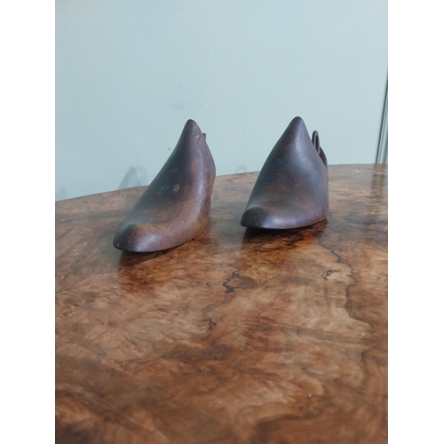 457 - Two early 20th C. American Sorosis walnut and brass shoe lasts. {24 cm H x 8 cm W x 10 cm D}.