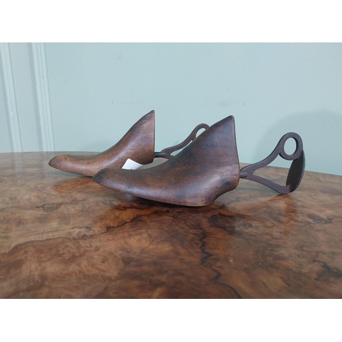 457 - Two early 20th C. American Sorosis walnut and brass shoe lasts. {24 cm H x 8 cm W x 10 cm D}.