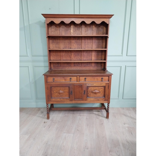 460 - Edwardian oak Welsh dresser with open shelves above two long drawers above two blind doors. {210 cm ... 