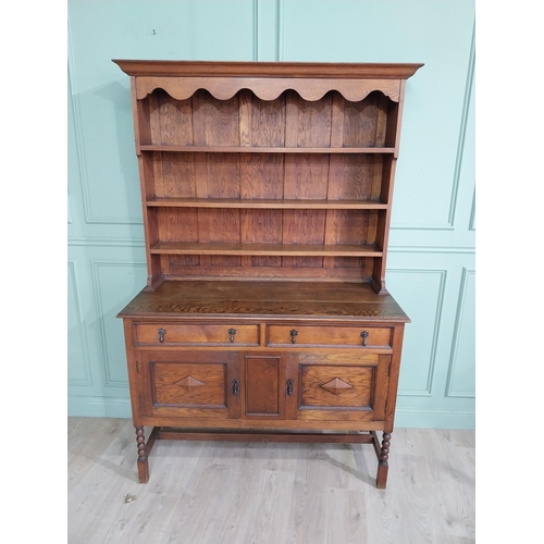 460 - Edwardian oak Welsh dresser with open shelves above two long drawers above two blind doors. {210 cm ... 