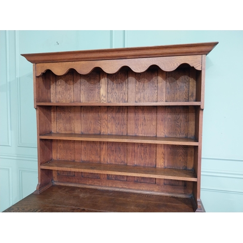 460 - Edwardian oak Welsh dresser with open shelves above two long drawers above two blind doors. {210 cm ... 