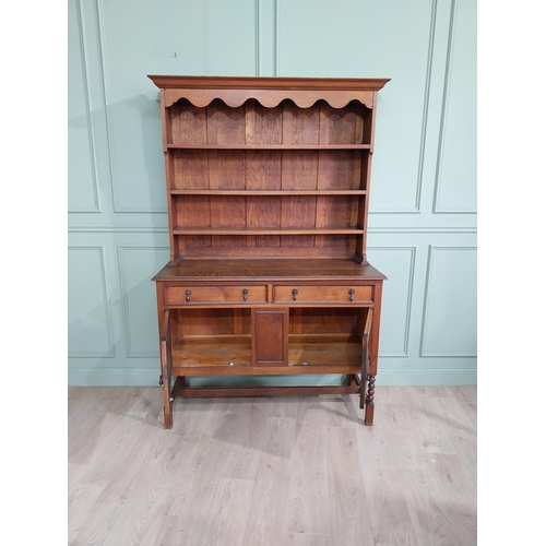 460 - Edwardian oak Welsh dresser with open shelves above two long drawers above two blind doors. {210 cm ... 