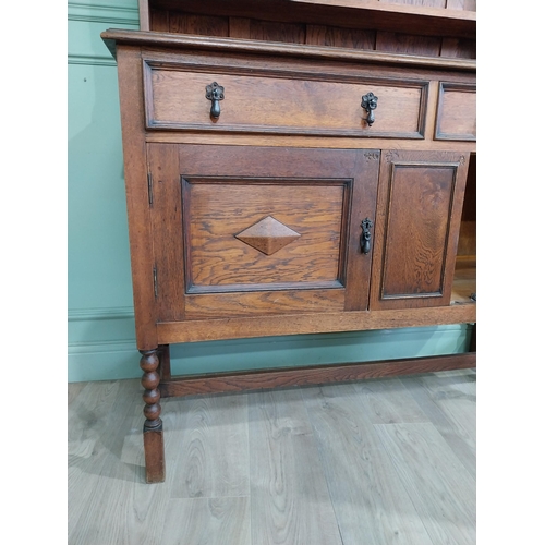 460 - Edwardian oak Welsh dresser with open shelves above two long drawers above two blind doors. {210 cm ... 