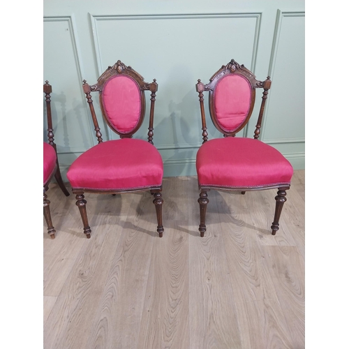 462 - Set of four 19th C. Walnut side chairs with carved back flanked by turned supports raised on tapered... 