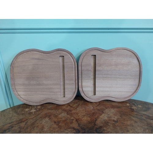 468 - Two mahogany chopping boards. {30 cm H x 35 cm W}.