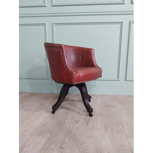 47 - Edwardian mahogany and leather swivel office chair. {74 cm H x 57 cm W x 55 cm D}.