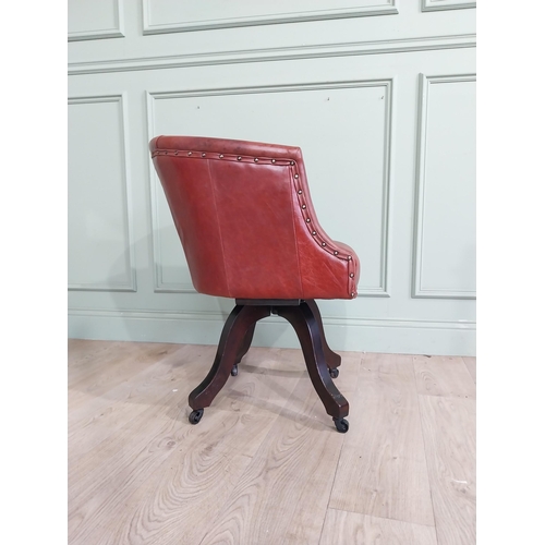 47 - Edwardian mahogany and leather swivel office chair. {74 cm H x 57 cm W x 55 cm D}.