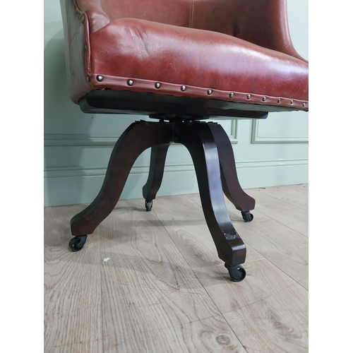 47 - Edwardian mahogany and leather swivel office chair. {74 cm H x 57 cm W x 55 cm D}.