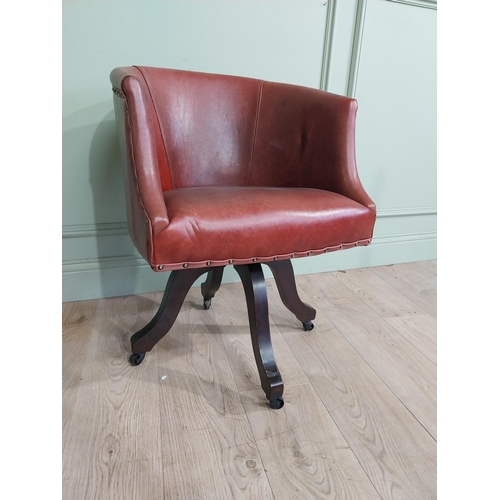 47 - Edwardian mahogany and leather swivel office chair. {74 cm H x 57 cm W x 55 cm D}.