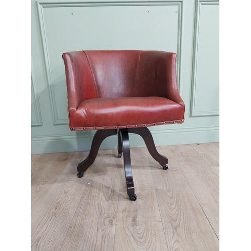 47 - Edwardian mahogany and leather swivel office chair. {74 cm H x 57 cm W x 55 cm D}.