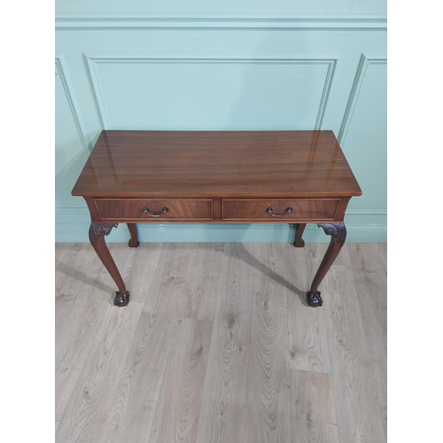 473 - Edwardian mahogany side table in the Georgian style with two short drawers in frieze raised on cabri... 