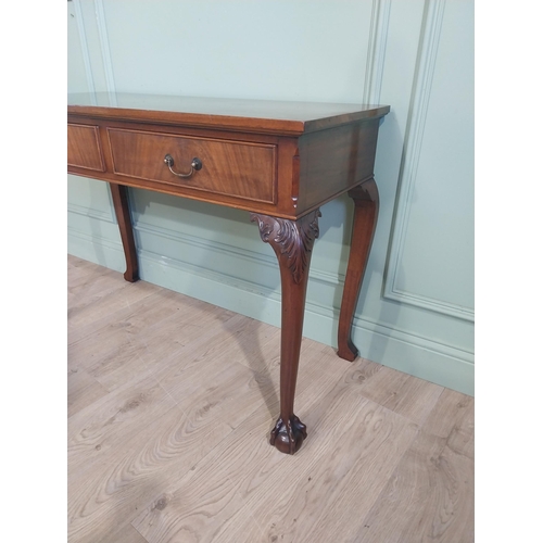 473 - Edwardian mahogany side table in the Georgian style with two short drawers in frieze raised on cabri... 