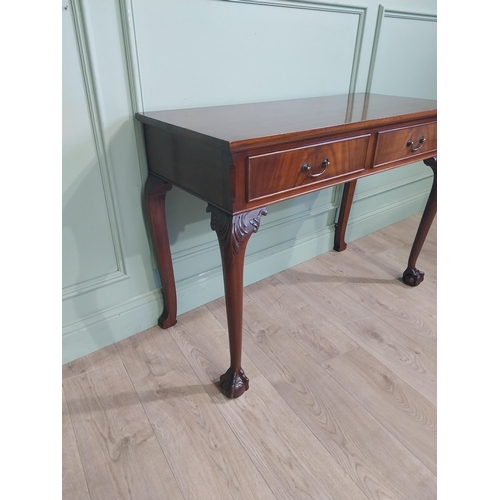 473 - Edwardian mahogany side table in the Georgian style with two short drawers in frieze raised on cabri... 