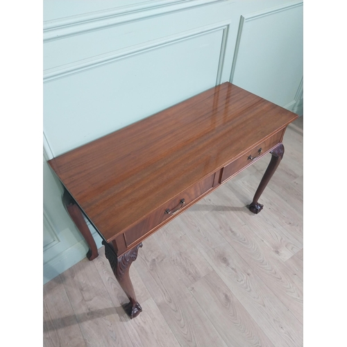 473 - Edwardian mahogany side table in the Georgian style with two short drawers in frieze raised on cabri... 