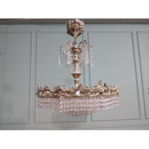 474 - 1950�s French brass and crystal drop chandelier. {70 cm H x 52 cm Dia.}.