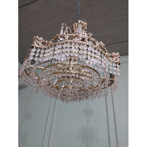 474 - 1950�s French brass and crystal drop chandelier. {70 cm H x 52 cm Dia.}.