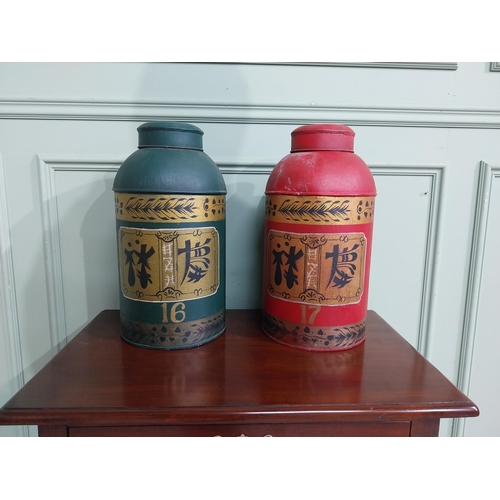 475 - Two oriental hand painted metal tea bins. {45 cm H x 22 cm Dia.}.