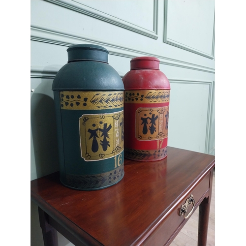 475 - Two oriental hand painted metal tea bins. {45 cm H x 22 cm Dia.}.