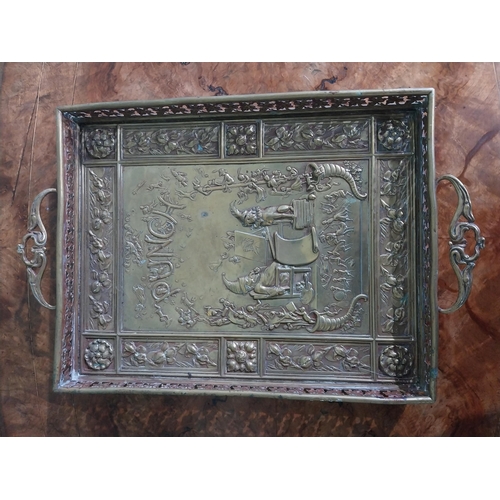 476 - Edwardian embossed brass Punch and Judy serving tray. {5 cm H x 36 cm W x 23 cm D}.