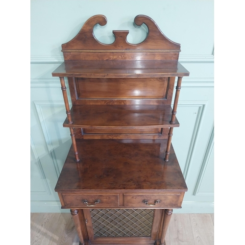 483 - Good quality yew wood side cabinet in the Regency style fitted with two shelves and two short drawer... 