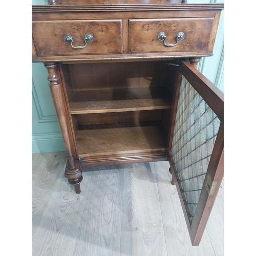 483 - Good quality yew wood side cabinet in the Regency style fitted with two shelves and two short drawer... 