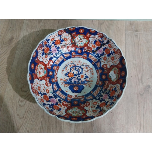 486 - Large 19th C. Oriental ceramic Imari bowl. (damaged){13 cm H x 38 cm Dia.}.