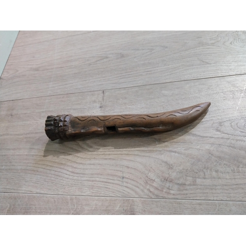 501 - Carved African hardwood sheath. {24 cm L}.