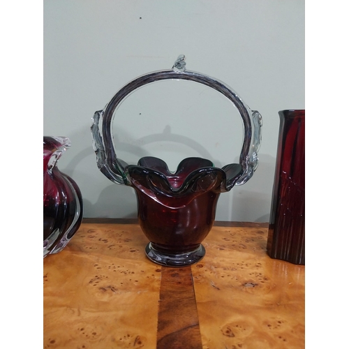 503 - Five pieces of ruby glass � basket and four vases. {22 cm H to 8 cm H}.