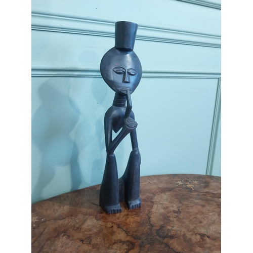 507 - Carved hardwood African figure of Man smoking pipe. {50 cm H x 13 cm W x 9 cm D}.