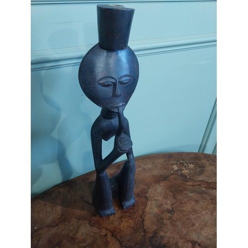 507 - Carved hardwood African figure of Man smoking pipe. {50 cm H x 13 cm W x 9 cm D}.