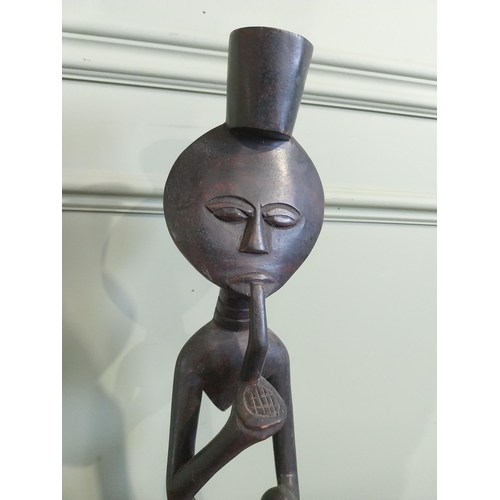 507 - Carved hardwood African figure of Man smoking pipe. {50 cm H x 13 cm W x 9 cm D}.