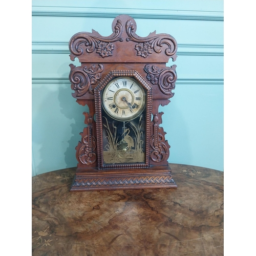 511 - Edwardian mahogany Gingerbread clock with painted dial. {59 cm H x 39 cm W x 13 cm D}.