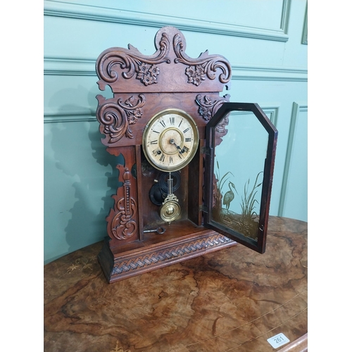 511 - Edwardian mahogany Gingerbread clock with painted dial. {59 cm H x 39 cm W x 13 cm D}.