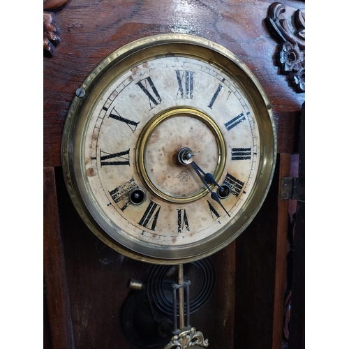 511 - Edwardian mahogany Gingerbread clock with painted dial. {59 cm H x 39 cm W x 13 cm D}.