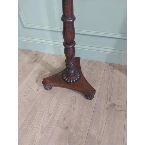 514 - William IV rosewood pole fire screen on single turned column raised on platform base and castors. {1... 